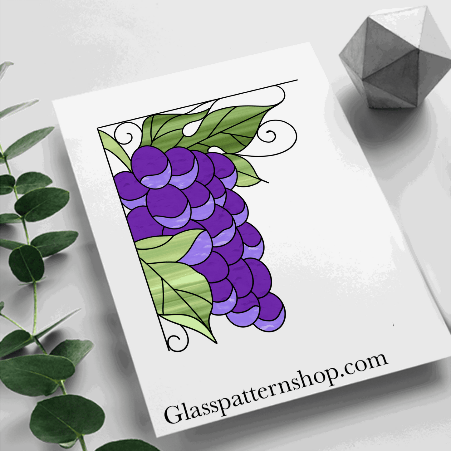 A stained glass pattern featuring a cluster of grapes with vines, designed as a corner panel for customisable stained glass projects.