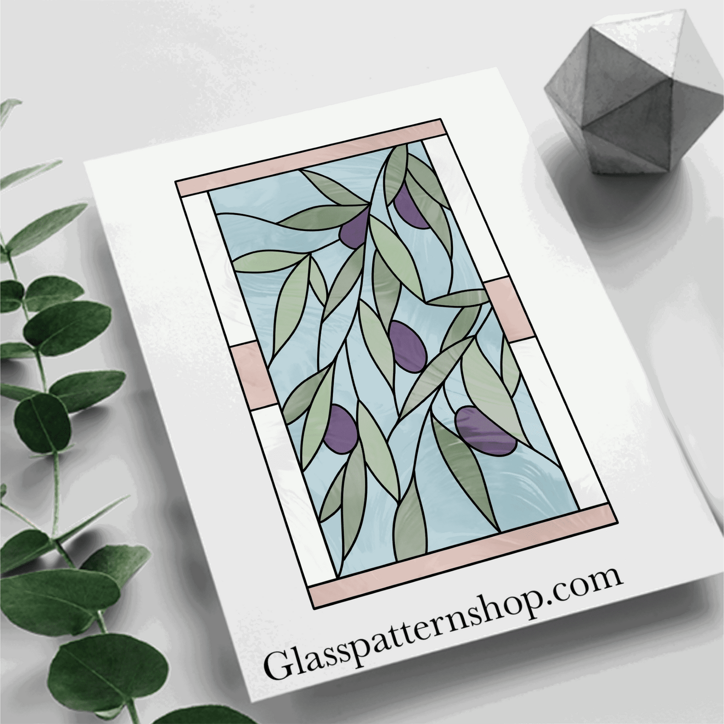 A stained glass pattern featuring an olive branch with detailed leaves and olives, framed within a square, designed for customisable stained glass projects.