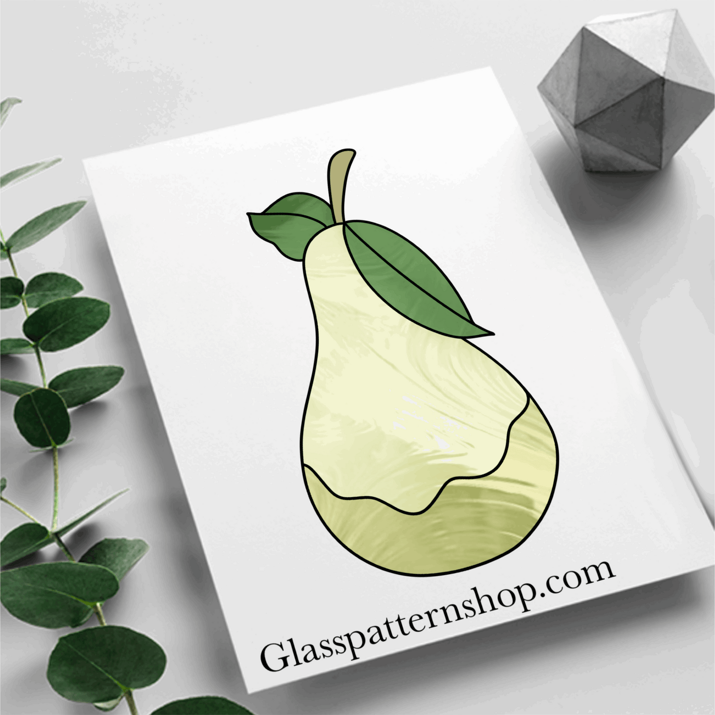 A stained glass pattern featuring a pear with detailed leaves, designed for vibrant and customisable stained glass projects.