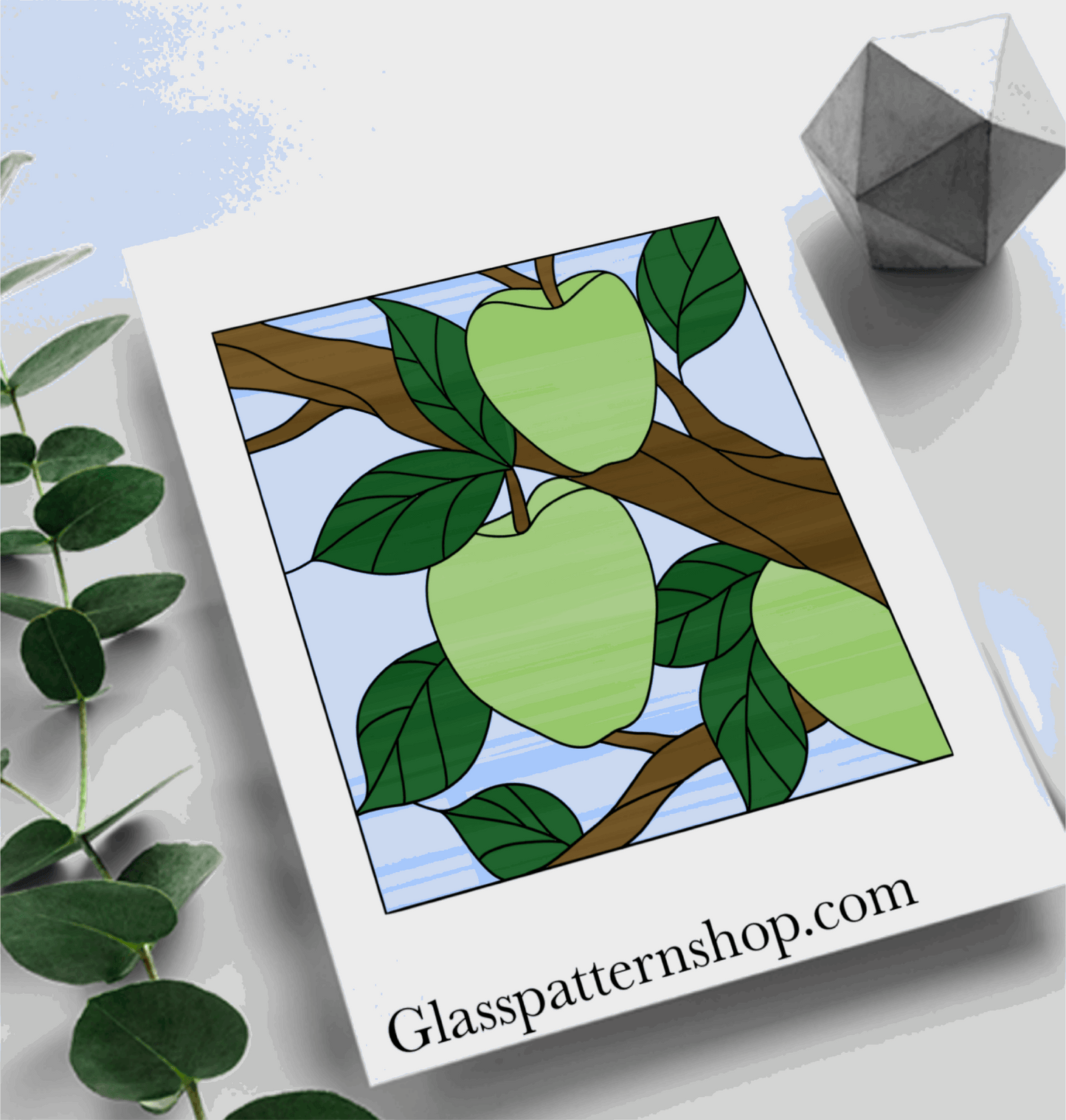 A stained glass panel pattern featuring a cluster of apples with leaves, designed for creating vibrant, customizable fruit-themed window art.