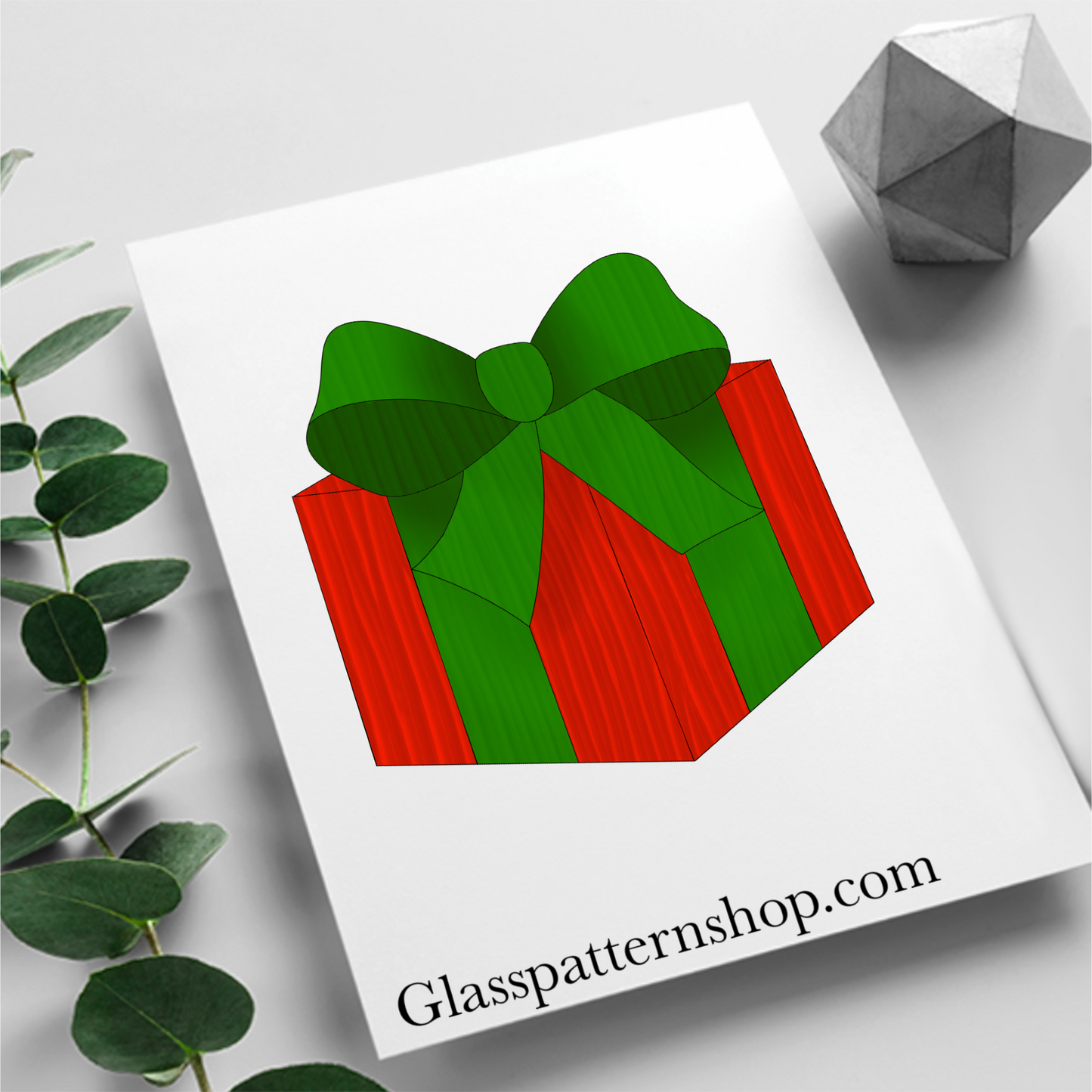 Digital stained glass pattern featuring a colorful gift box tied with a bow, ideal for festive or holiday-themed designs.