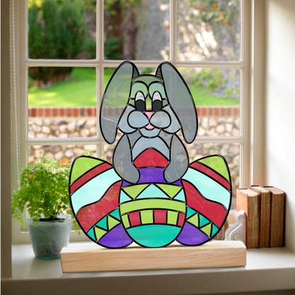 Cute Bunny Stained Glass Pattern – A digital stained glass outline of a cute bunny sitting with three decorated Easter eggs.