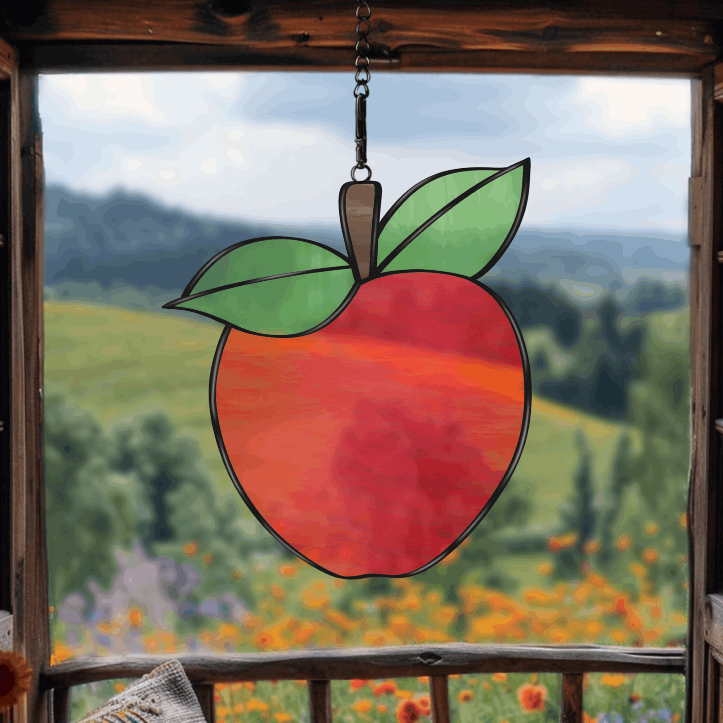 A printable apple stained glass pattern featuring a classic apple shape with a leaf, designed for easy customization with various glass colors and textures.