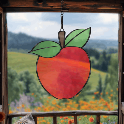 A printable apple stained glass pattern featuring a classic apple shape with a leaf, designed for easy customization with various glass colors and textures.