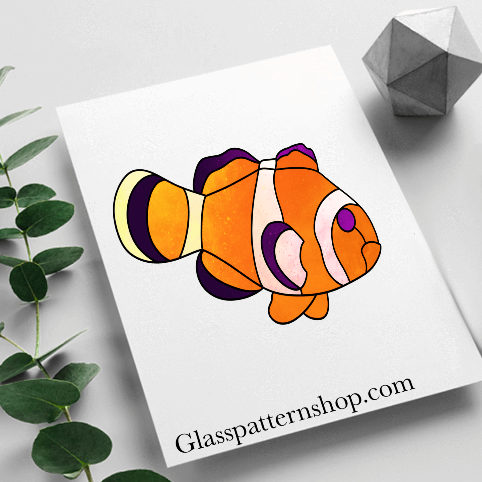 Tropical clown fish stained glass pattern, colorful ocean-themed glass design.