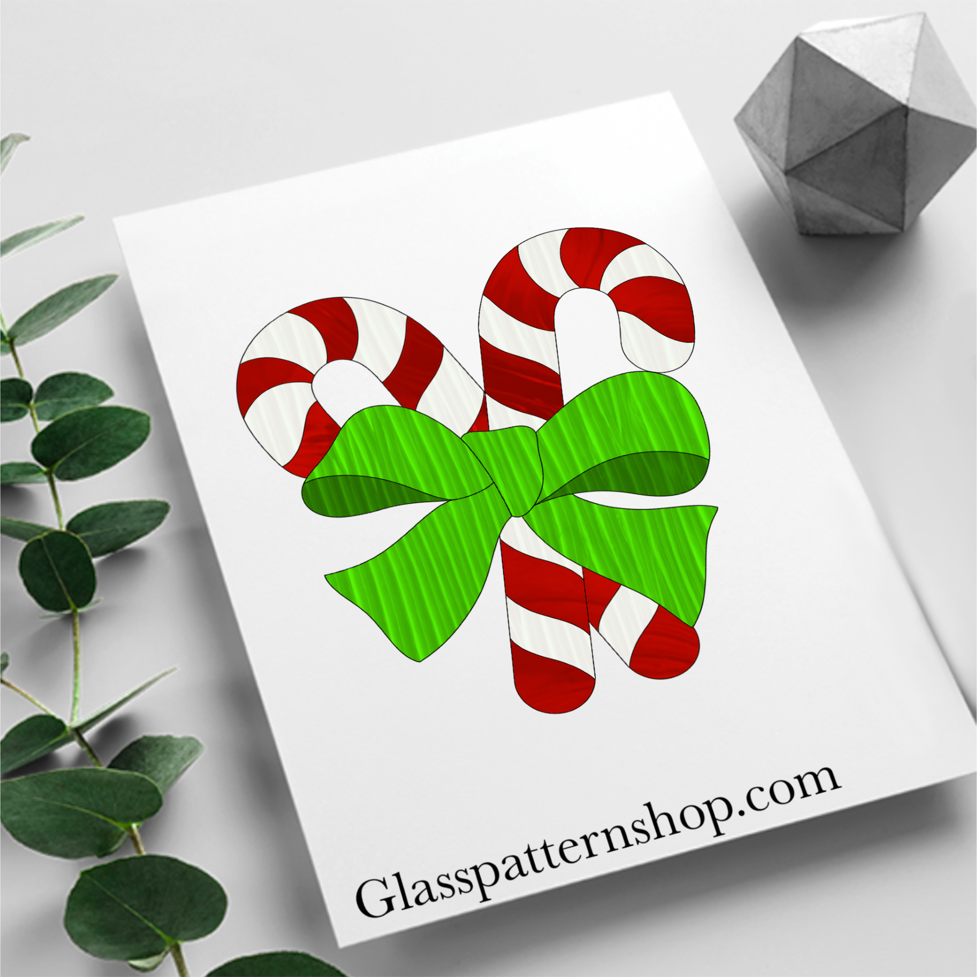 Digital stained glass pattern featuring crossed candy canes tied with a decorative bow, ideal for festive or holiday-themed designs