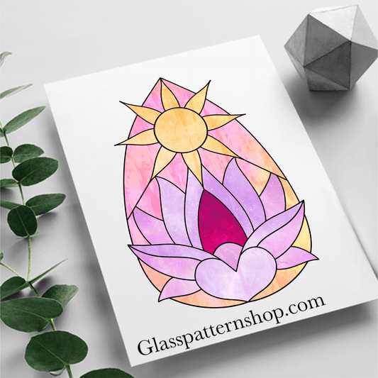 Celestial sun, heart, and lotus flower teardrop shape suncatcher stained glass pattern, unique and vibrant design.