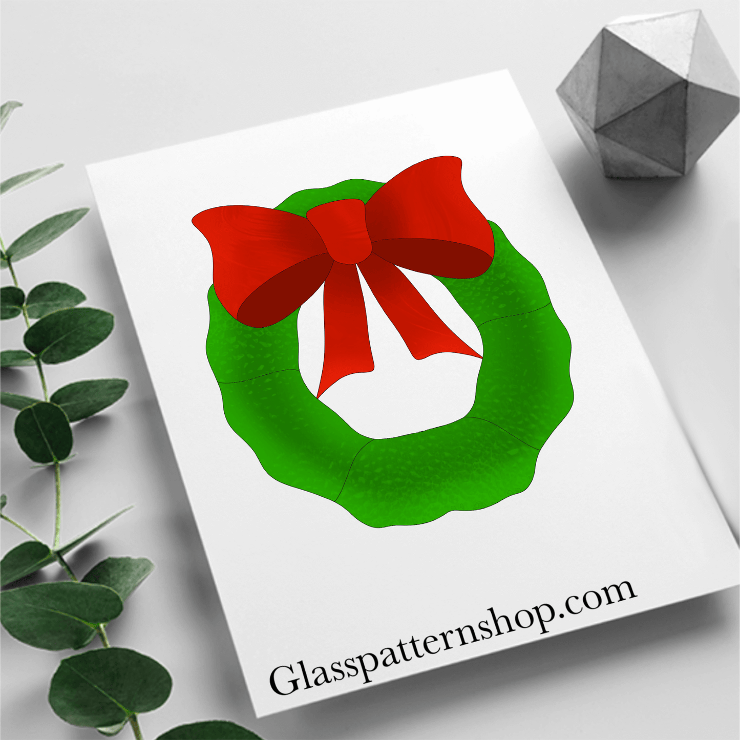 Digital stained glass pattern featuring a Christmas wreath adorned with a decorative bow, perfect for holiday decorations.